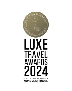 a dollar coin with the words luxury travel awards at Monument House in Franschhoek