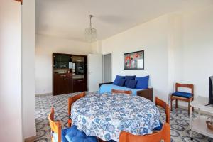 a bedroom with a bed and a table and chairs at Mare Fuori in Nettuno