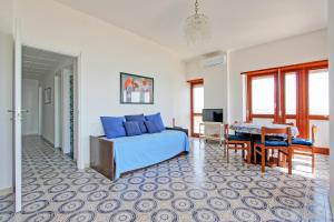 a bedroom with a bed and a table and a desk at Mare Fuori in Nettuno