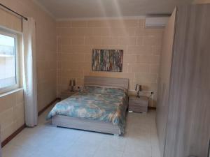Postel nebo postele na pokoji v ubytování Hideaway Flats