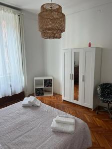 a bedroom with a bed with two towels on it at Aldebaran in Milan
