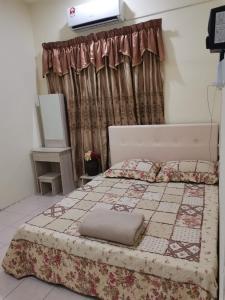 Postelja oz. postelje v sobi nastanitve Jalinan Qaseh Homestay