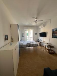a large living room with a bed and a table at Tigullio 38 by PortofinoVacanze in Rapallo