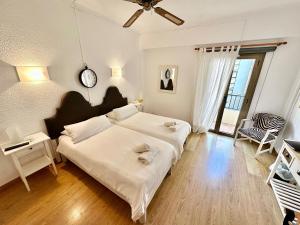 Postel nebo postele na pokoji v ubytování Hotel Marbel