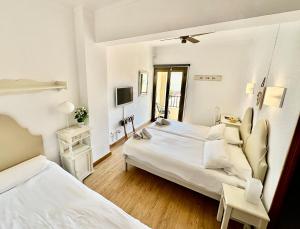 Postel nebo postele na pokoji v ubytování Hotel Marbel