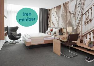 Cama ou camas em um quarto em Living Hotel Frankfurt