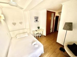 Postel nebo postele na pokoji v ubytování Hotel Marbel