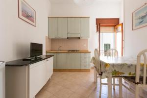 Kuchyň nebo kuchyňský kout v ubytování Casa Coralli Centro Storico