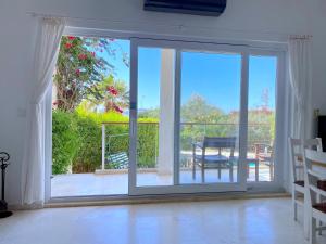 a sliding glass door with a view of a patio at Akdeniz Villa in Kas