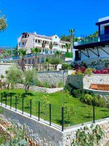 a garden in front of a house at Akdeniz Villa in Kas