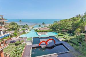 an aerial view of a pool at a resort at ShaSa Resort & Residences, Koh Samui - SHA Extra Plus in Lamai
