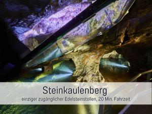 a close up of a rock cave with a knife at Natur-Chalet zum Nationalpark Franz inkl. E-Auto in Allenbach +54 photos