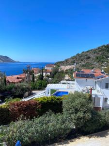 a view of a town with the ocean in the background at Akdeniz Villa in Kas