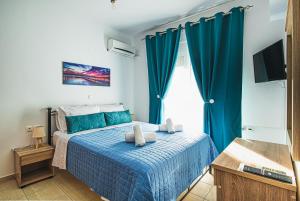 A bed or beds in a room at Basiliki's Apartments