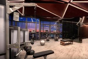 a fitness room with a gym with equipment in it at Edge Central Pattaya, Luxury Place, High Speed internet in Pattaya Central