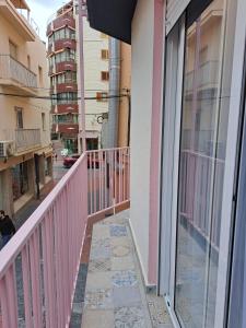 a balcony of a building with a pink railing at Chloe37 in Benidorm