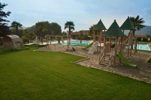 a park with a playground with a slide at Residence La Berna in Tremosine Sul Garda