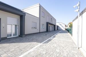 an empty alley between two buildings at The Residence 2.0 in Galliate