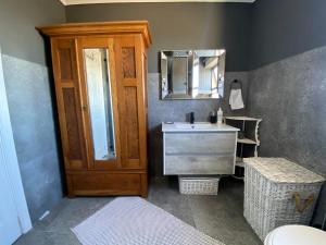 a bathroom with a sink and a mirror at 10 Summerplace in Knysna +29 photos