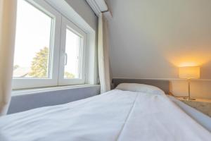 Postel nebo postele na pokoji v ubytování Hus Mattgoot - private Einzelzimmer im DG und 1 OG