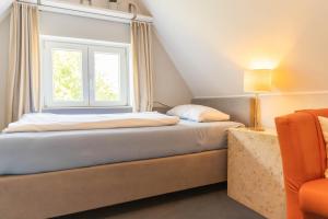 Postel nebo postele na pokoji v ubytování Hus Mattgoot - private Einzelzimmer im DG und 1 OG