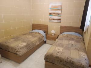 Postel nebo postele na pokoji v ubytování Hideaway Flats