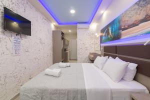 A bed or beds in a room at Sea Diamond Suites
