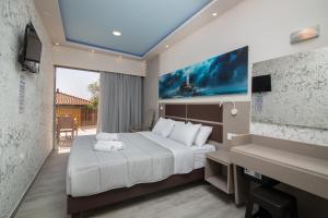 A bed or beds in a room at Sea Diamond Suites