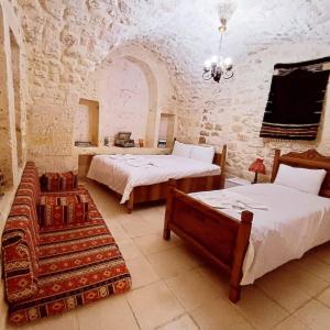 Cama ou camas em um quarto em Zininur boutique hotel