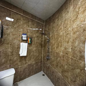 a bathroom with a shower and a toilet at Houses for COP29 in Baku