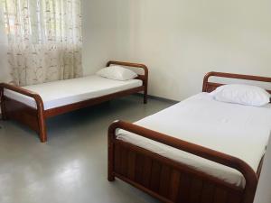 Voodi või voodid majutusasutuse 1818 Badulla toas