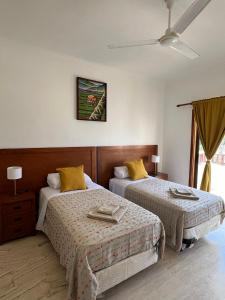 a bedroom with two beds and a window at MagicCana arena blanca beach in Punta Cana