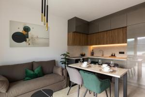 a living room with a couch and a table at Luxury Apartments Blue Moon - New Apartments in Slano