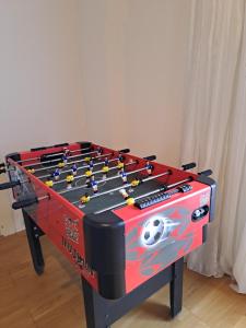 a foosball table with a soccer ball on it at TheGarden Bed&Bike in Gmunden