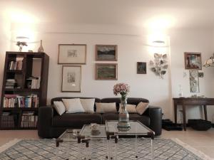 a living room with a couch and a table at CityView in Latina