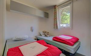 Ένα ή περισσότερα κρεβάτια σε δωμάτιο στο Camping Les Jardins d'Agathe - Maeva +24 φωτογραφίες