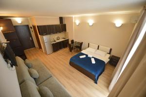 Postel nebo postele na pokoji v ubytování BATUMi WELLCOME ORBI APART HOTEL