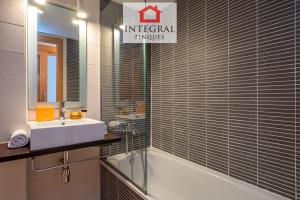 a bathroom with a sink and a bath tub and a sink at Dive Palamós in Palamós +12 photos