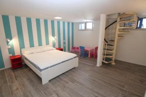 Un pat sau paturi într-o cameră la Villetta Seaside