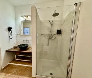 a bathroom with a shower and a sink at Casa Rural “Los Campos” in Almogía