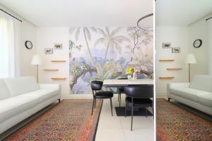 sala de estar con sofá blanco y mesa en Luxury Apartment con Terrazza, Palestra, CoWork & Box Privato en Milán