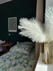 a bedroom with a bed with white feathers at Guesthouse in Weeze in Weeze