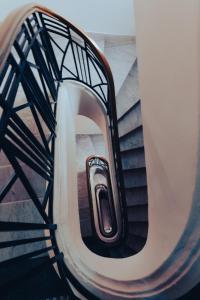 a spiral stair case with a cell phone on it at Olympic Inn Casablanca in Casablanca