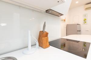 a kitchen with a counter top with a knife on it at Apartments Tauzer in Mandre +53 photos