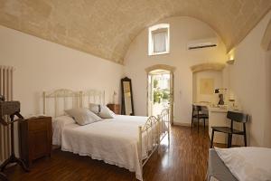 Una cama o camas en una habitación de Fra I Sassi Residence