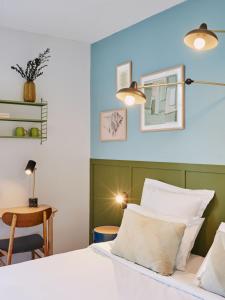 Postel nebo postele na pokoji v ubytování Hôtel Bordeaux Clémenceau by Happyculture