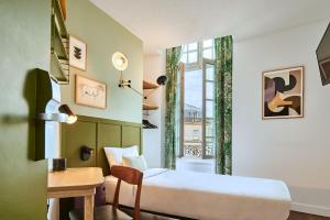 Postel nebo postele na pokoji v ubytování Hôtel Bordeaux Clémenceau by Happyculture