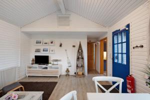 Μια τηλεόραση ή/και κέντρο ψυχαγωγίας στο Ferienhaus 'am Seeufer'