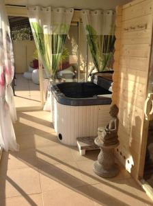 a room with a jacuzzi tub in a house at Villa Angel - SPA in Caunes-Minervois