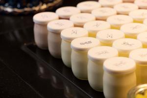 a row of bottles of honey on a table at Hôtel Diana Dauphine in Strasbourg +57 photos